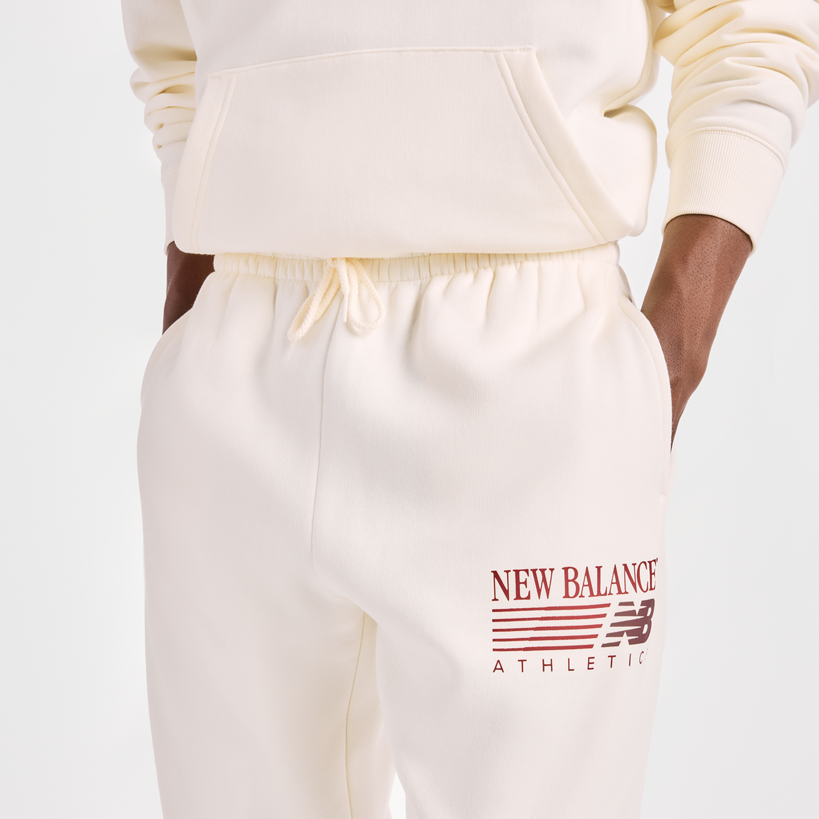 New Balance Reimagined Graphic Fleece Jogger in BEIGE