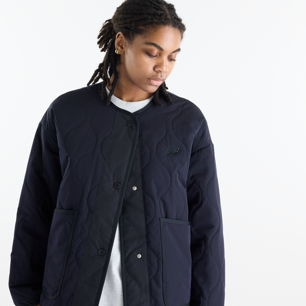 New Balance W Quilted Bomber in SCHWARZ