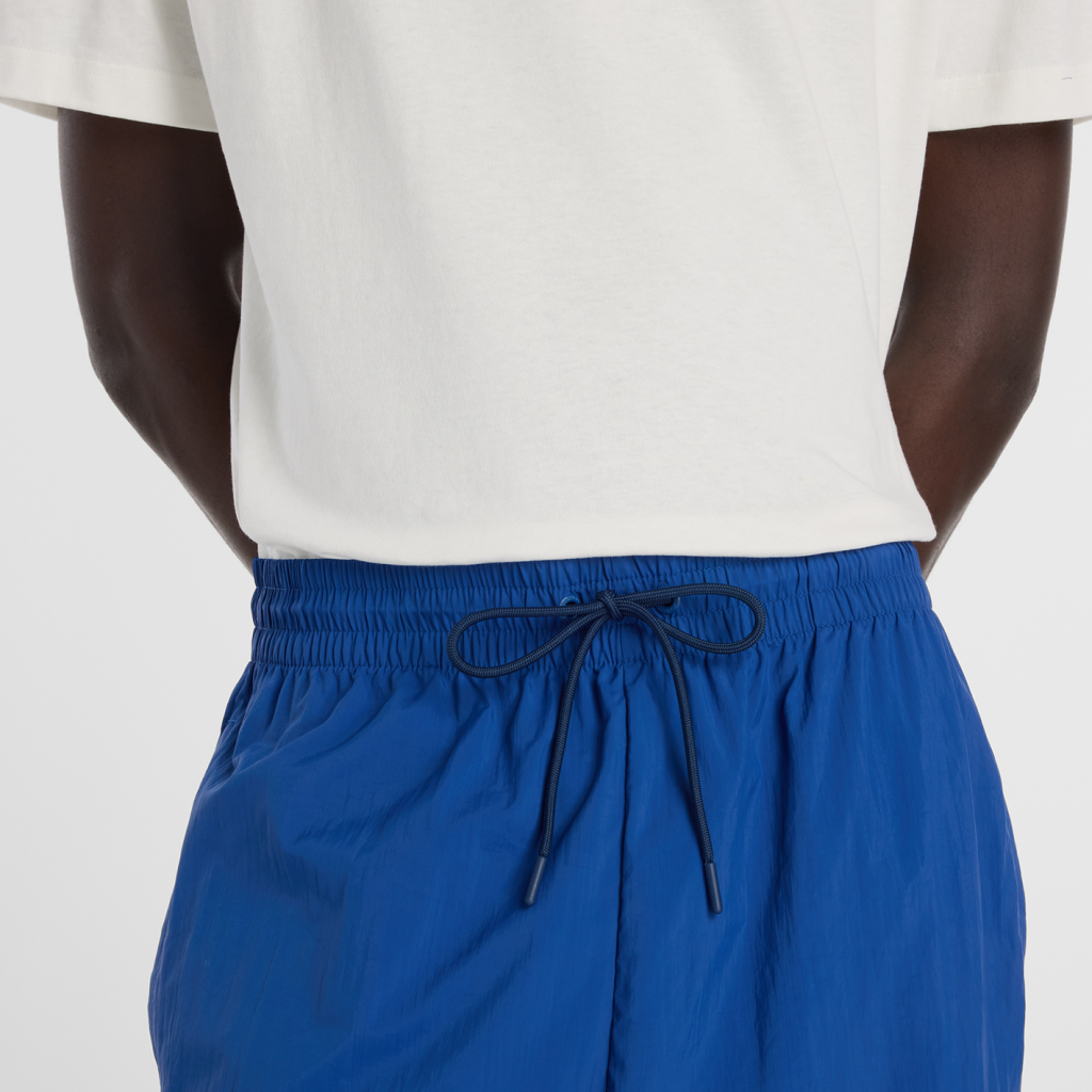 New Balance Sport Legacy Pant in BLAU