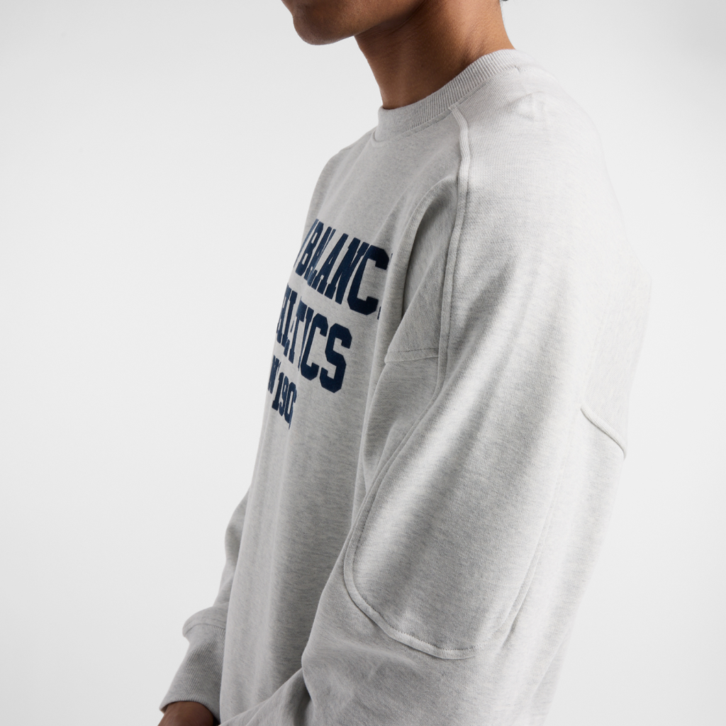 New Balance Varsity French Terry Graphic Crew in GRAU