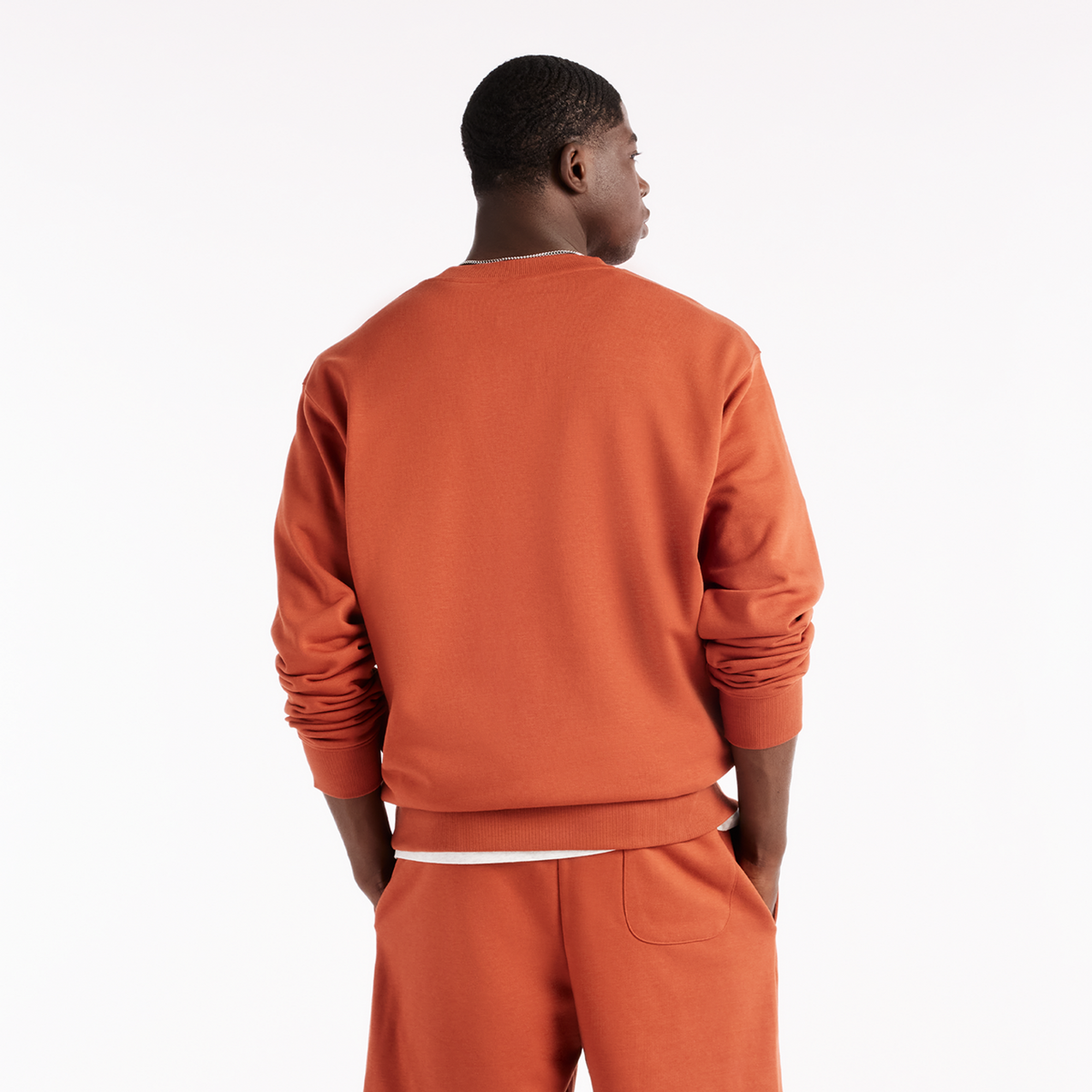 New Balance Sport Essentials Small Logo French Terry Crew in ROT