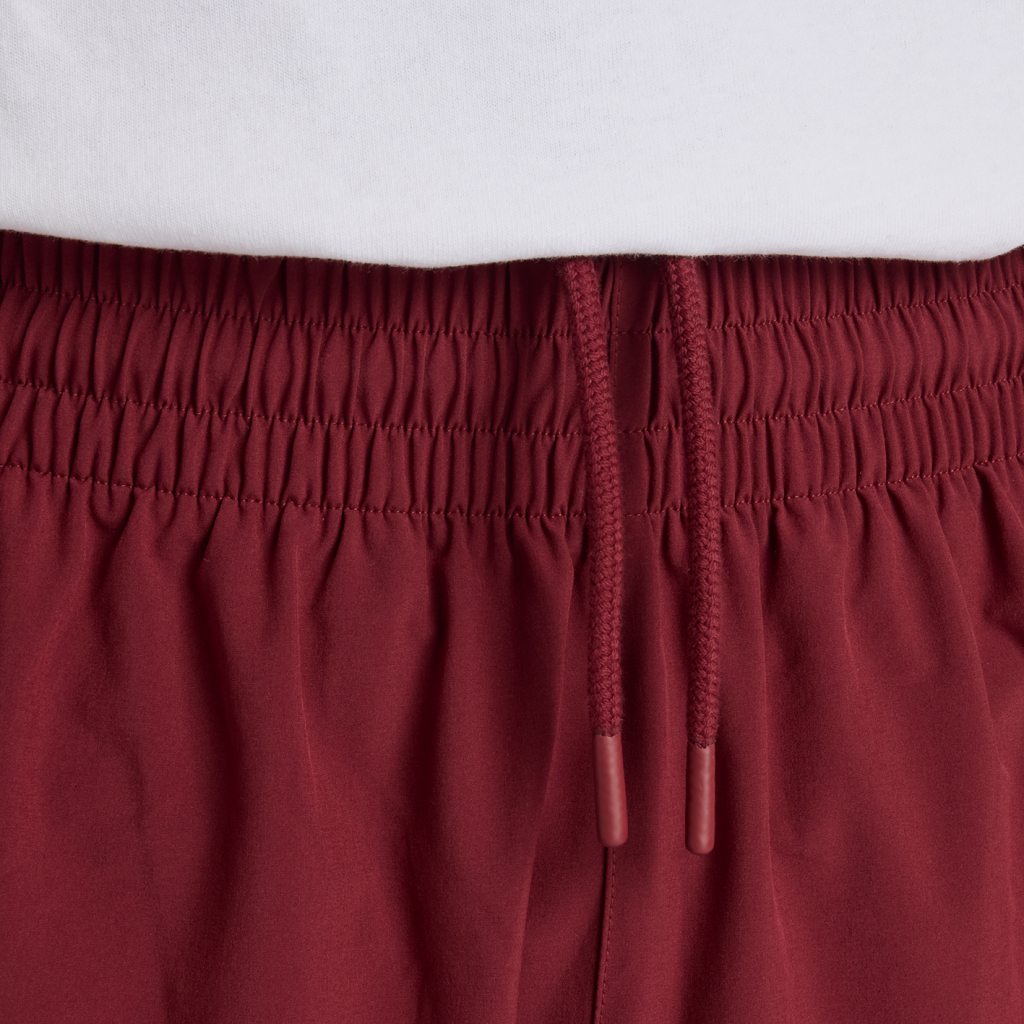 New Balance In Game Woven Track Pant in ROT